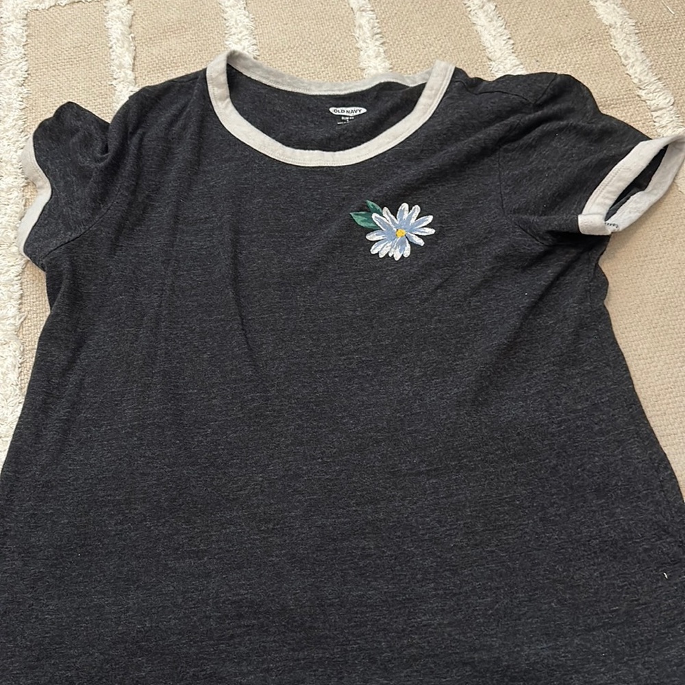 A black L Old Navy with a flower on it